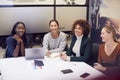 Group Of Businesswomen Collaborating In Creative Meeting Around Table In Modern Office Royalty Free Stock Photo