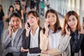 Group of businesswomen making a phone call
