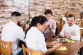 Group of busy friends using smartphones at restaurant Royalty Free Stock Photo