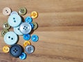 group of button studs on wooden background