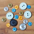 group of button studs on wooden background