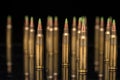 A group of 5.56 calibar, green tip bullets on black background