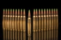 A group of 5.56 calibar, green tip bullets ordered into the lines on black background Royalty Free Stock Photo