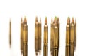 A group of 5.56 calibar, green tip bullets on white background