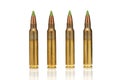 A group of 5.56 callibar, green tip bullets ordered into the line on white background Royalty Free Stock Photo