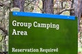 A group camping area sign indicating reservations are required Royalty Free Stock Photo