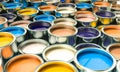 group of cans filled with coloured paint. 3d render