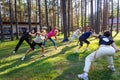 Group of capoeira students with master teacher