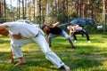 Group of capoeira students with master teacher