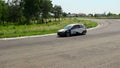 Group of cars racing on track, cornering on high speed