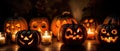 group of carved jack - o\' - lanterns with candles flickering inside, casting spooky shadows Halloween scene Royalty Free Stock Photo