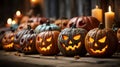 A group of carved pumpkins with lit candles