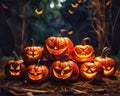 A group of carved pumpkins sitting on top of a pile of hay. Royalty Free Stock Photo