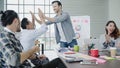 Group of casually dressed business people discussing ideas in the office. Creative professionals gathered at the meeting table for Royalty Free Stock Photo