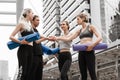 Group of caucasian yoga team cheering up team spirit by having hands touch together