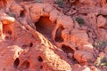Group of cave openings in red rock, Valley of Fire, Nevada, USA