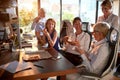 Group of cheerful business women are enjoying a pizza while chatting at the break from work at workplace. Business, office, job Royalty Free Stock Photo