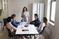 Group of cheerful businesspeople take part in morning briefing