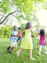 Group of Cheerful Children Playing in the Park Royalty Free Stock Photo
