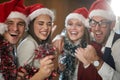 A group of cheerful colleagues having wonderful time together at New Year celebration in the hallway at workplace. Together, New