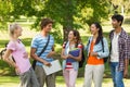 Group of cheerful college friends in campus