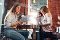 Group of cheerful creative businesswomen working on their joint startup project Royalty Free Stock Photo