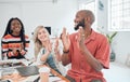Group of cheerful diverse businesspeople having a meeting in a modern office at work. Joyful colleagues clapping hands Royalty Free Stock Photo