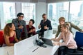 Group of cheerful multiethnic business people, company staff, and workers in a modern office Royalty Free Stock Photo