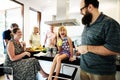 Group of cheerful people in the kitchen