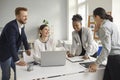 Group of happy young diverse business people talking, sharing funny ideas and laughing Royalty Free Stock Photo