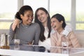 Group of cheerful pretty girls enjoying meeting in cafe Royalty Free Stock Photo