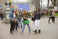 Group of cheerful teens girls dancing on the street. Kyiv, Ukraine
