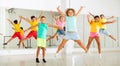 Group of cheerful tweens jumping during dances class