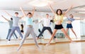 Group of cheerful tweens jumping during dances class