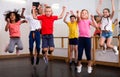 Cheerful tweens jumping during modern dances class
