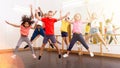 Cheerful tweens jumping during modern dances class