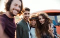 A group of young friends on a roadtrip through countryside, taking selfie. Royalty Free Stock Photo