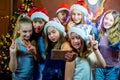 Group of cheerful young girls celebrating Christmas. Selfie Royalty Free Stock Photo