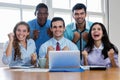 Group of cheering latin and african american and caucasian businesspeople