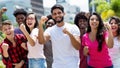 Group of cheering latin and caucasian and hispanic and african american young adults