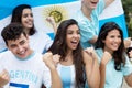 Group of cheering soccer fans from Argentina with argentinian fl Royalty Free Stock Photo