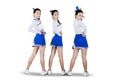 Group of cheerleader girls standing on studio Royalty Free Stock Photo