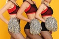 Group of cheerleaders on yellow background, closeup