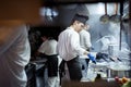 Group of chef preparing food in the kitchen of a restaurant Royalty Free Stock Photo