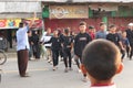 A group of children crossing the main road