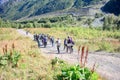 A group of children doing Nordic walking follow the route in the highlands