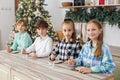 Group children draws food paints on Christmas homemade gingerbread cookies. Christmas concept