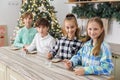 Group children draws food paints on Christmas homemade gingerbread cookies. Christmas concept