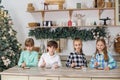 Group children draws food paints on Christmas homemade gingerbread cookies. Christmas concept