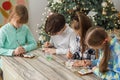 Group children draws food paints on Christmas homemade gingerbread cookies. Christmas concept